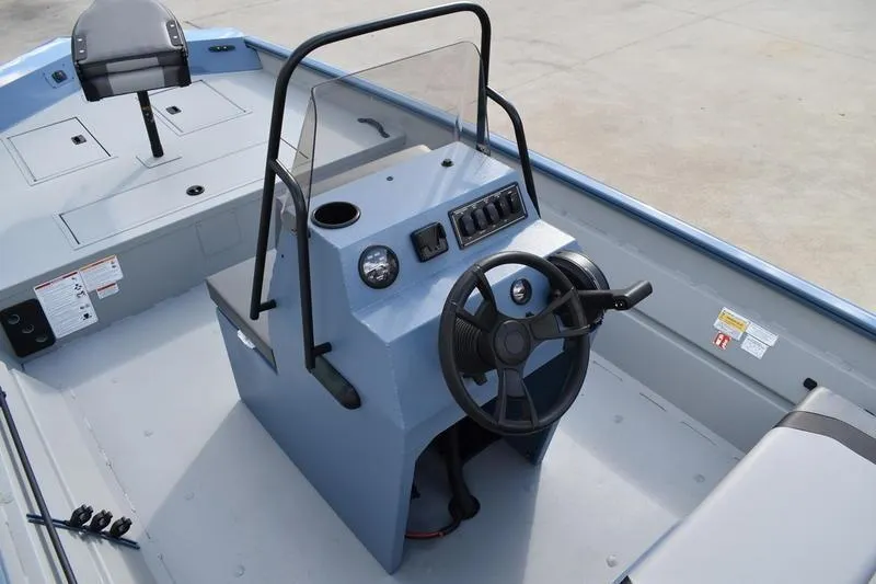 Slide: The Image of Control panel of 2026 Lowe Roughneck RX2070 CC boat with switches and RPM gauge. - 32