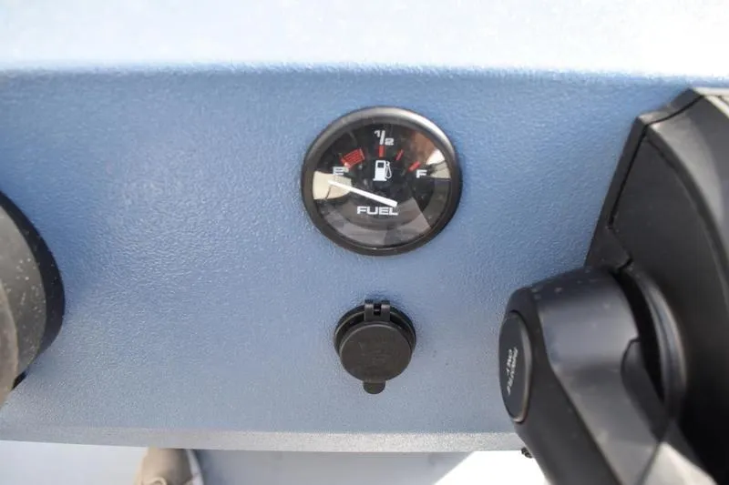 Slide: The Image of 2026 Lowe Roughneck RX2070 CC boat console and seating detail, featuring blue finish and storage handle. - 35