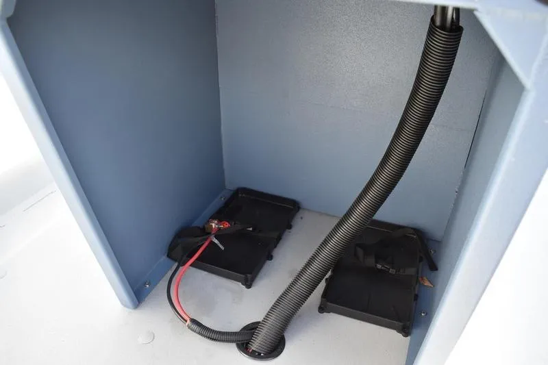 Slide: The Image of 2026 Lowe Roughneck RX2070 CC boat seat with gray upholstery and Mercury engine in background. - 36