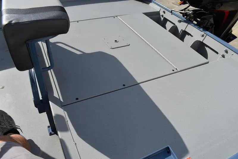 Slide: The Image of Trailer wheel of 2026 Lowe Roughneck RX2070 CC boat, featuring sleek black alloy rim. - 40