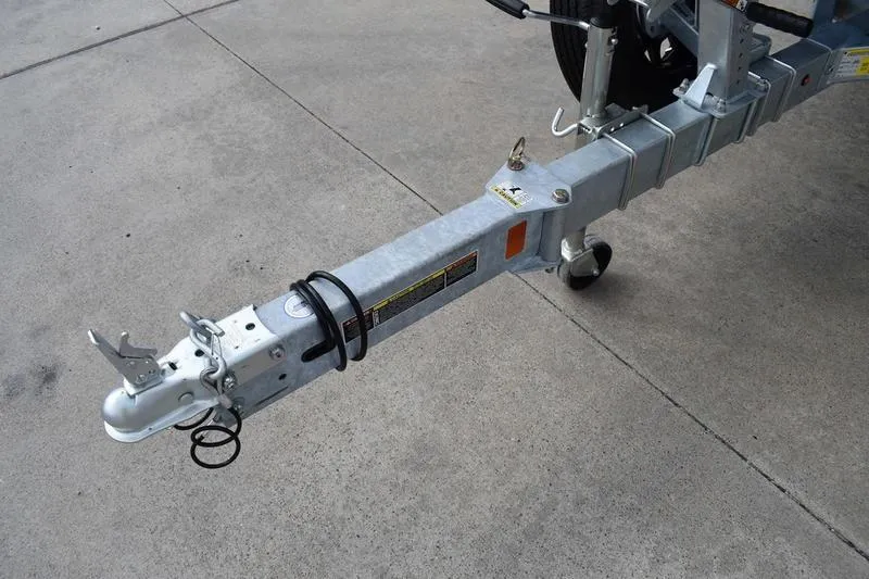 Slide: The Image of 2026 Lowe Roughneck RX2070 CC boat on trailer, parked outdoors. - 8