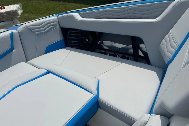 Slide: The Image of Interior of 2025 Nautique Super Air Nautique G23 boat with blue and gray seating. - 28