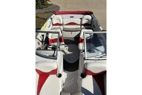 Slide: The Image of 2004 Tahoe Q-4 boat interior with red and white seating, open bow design. - 3
