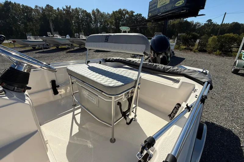 Slide: The Image of 2025 Carolina Skiff 192 JLS boat interior with seating and steering wheel. - 15