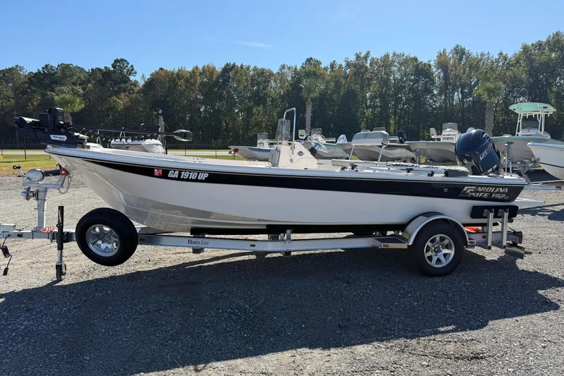 Slide: The Image of 2025 Carolina Skiff 192 JLS boat on trailer in outdoor setting. - 16
