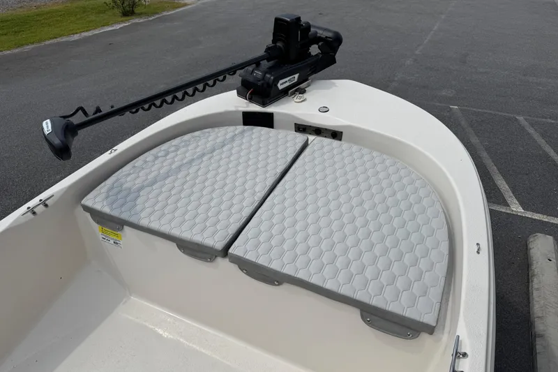 Slide: The Image of 2025 Carolina Skiff 192 JLS boat with cushioned bow seating and trolling motor. - 5