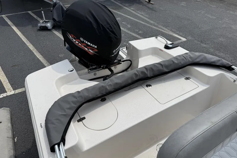 Slide: The Image of 2025 Carolina Skiff 192 JLS boat with Yamaha outboard motor in parking lot. - 7