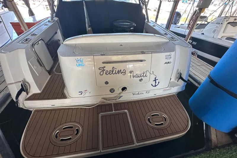 Slide: The Image of 2008 Sea Ray 290 Amberjack boat docked, featuring custom name "Feeling Nauti." - 33