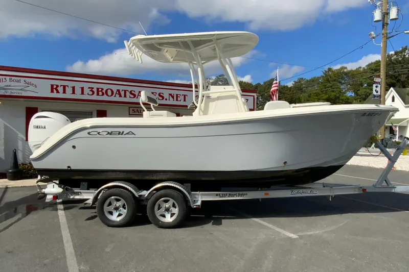 The Image of 2025 Cobia 220 Center Console boat on trailer at RT113 Boat Sales. - 1