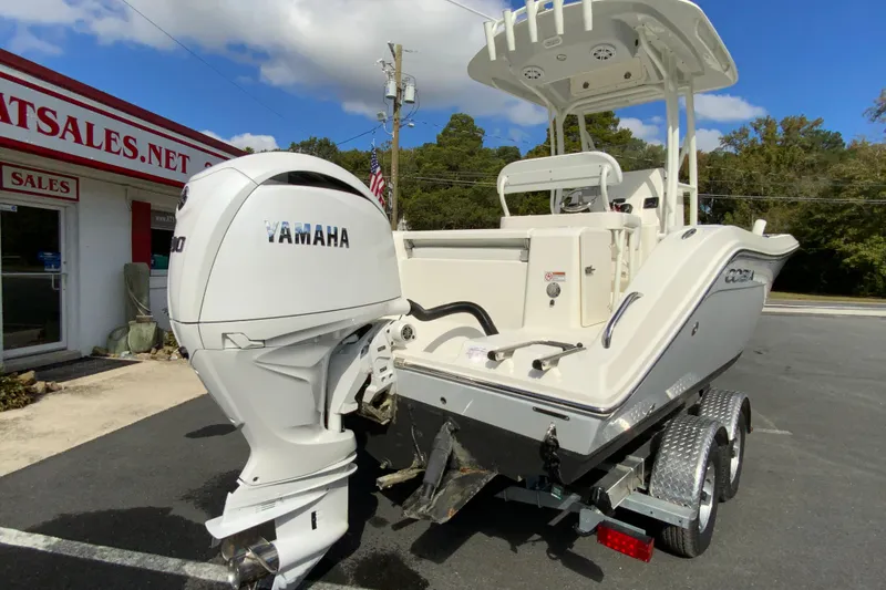 Slide: The Image of 2025 Cobia 220 Center Console boat with Yamaha engine on trailer. - 11