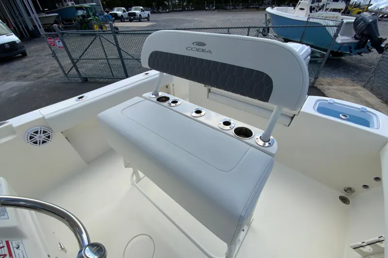 Slide: The Image of 2025 Cobia 220 Center Console boat interior with seating and cup holders. - 17
