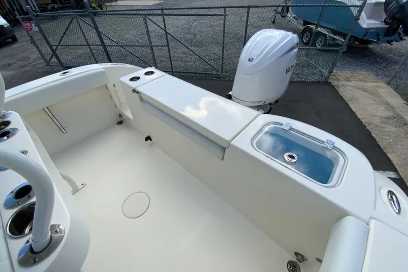 Slide: The Image of 2025 Cobia 220 Center Console boat interior with Yamaha outboard motor. - 18