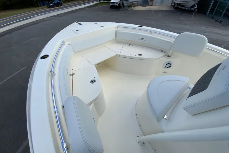 Slide: The Image of 2025 Cobia 220 Center Console boat interior with seating and storage compartments. - 22