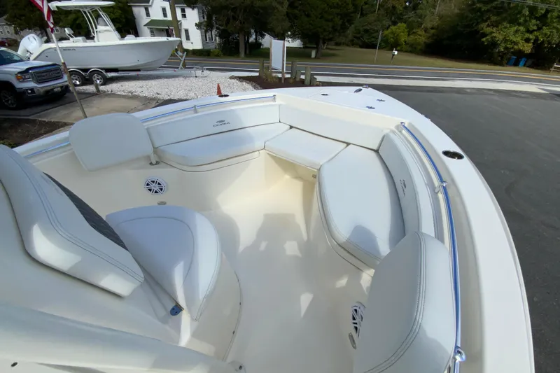 Slide: The Image of 2025 Cobia 220 Center Console boat with spacious seating and sleek design. - 24
