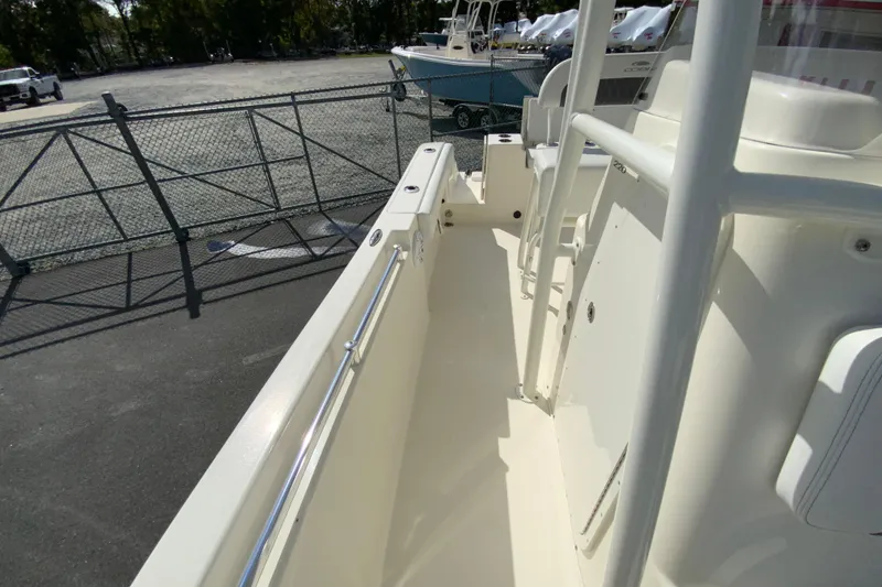 Slide: The Image of 2025 Cobia 220 Center Console boat interior with sleek design and sturdy railings. - 33