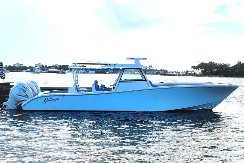 The Image of 2022 Yellowfin 42 Offshore boat on calm water, side view. - 0