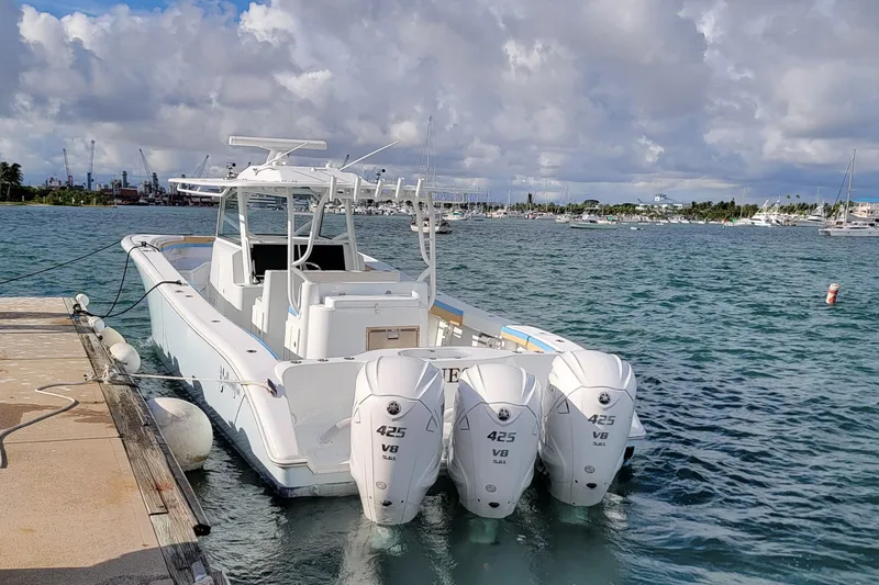 Slide: The Image of 2022 Yellowfin 42 Offshore boat docked with triple 425 V8 engines. - 12