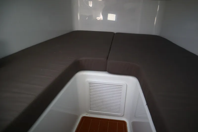 Slide: The Image of Interior cabin of 2022 Yellowfin 42 Offshore boat with cushioned seating. - 23