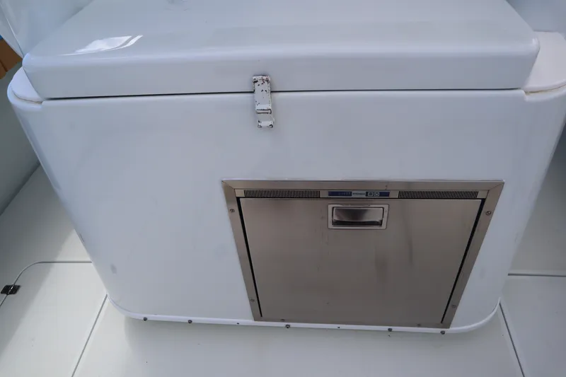 Slide: The Image of 2022 Yellowfin 42 Offshore boat interior with built-in stainless steel storage compartment. - 35