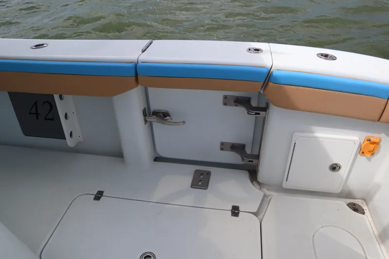 Slide: The Image of 2022 Yellowfin 42 Offshore boat interior with seating and storage compartments. - 38