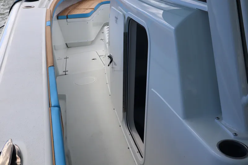 Slide: The Image of 2022 Yellowfin 42 Offshore boat interior with sleek design and comfortable seating. - 40