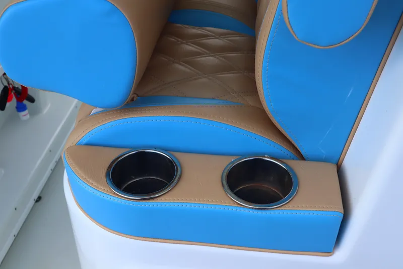 Slide: The Image of Blue and tan seating with cup holders on a 2022 Yellowfin 42 Offshore boat. - 41