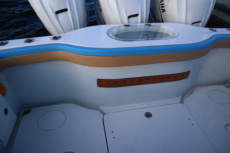 Slide: The Image of 2022 Yellowfin 42 Offshore boat deck with measuring ruler and Yamaha engines. - 56