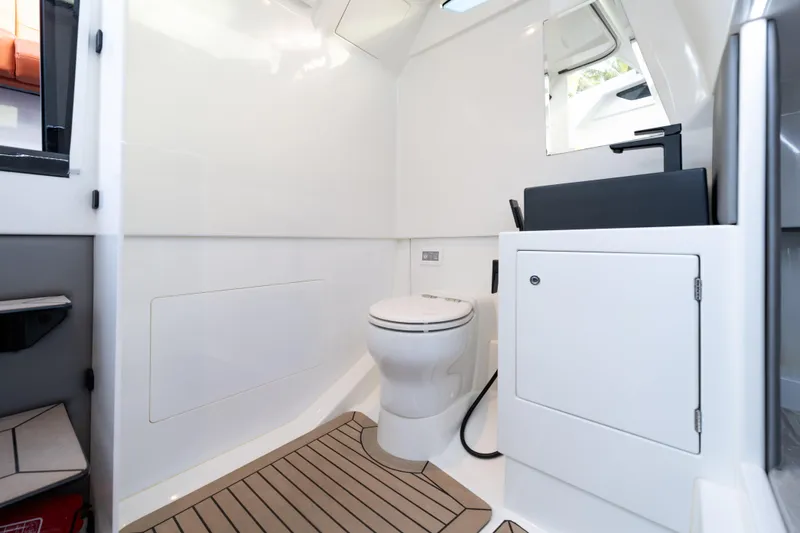 Slide: The Image of 2023 Vanquish Yachts Sports Line Outboard interior bathroom with modern fixtures. - 15