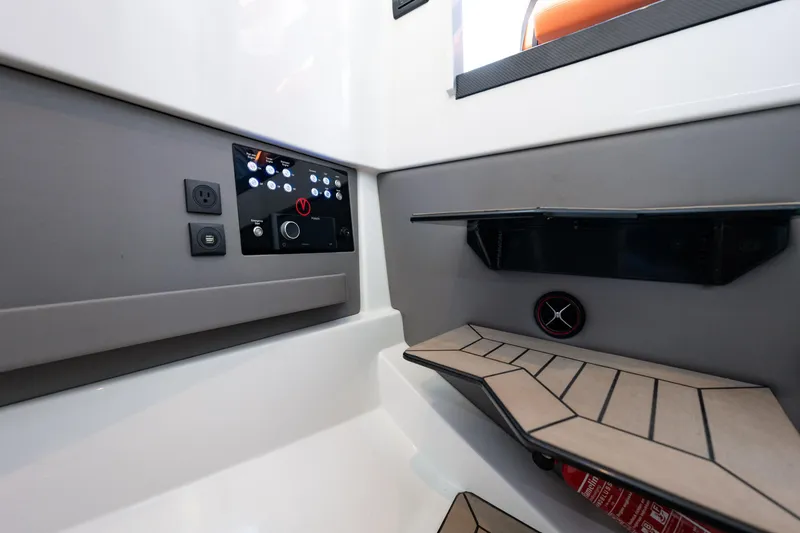 Slide: The Image of 2023 Vanquish Yachts Sports Line Outboard interior with control panel and modern design. - 16