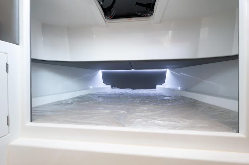 Slide: The Image of Interior cabin of 2023 Vanquish Yachts Sports Line Outboard, featuring sleek modern design. - 19