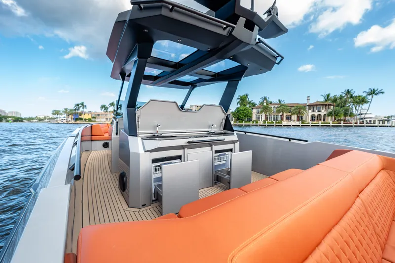 Slide: The Image of 2023 Vanquish Yachts Sports Line Outboard with luxurious seating and modern amenities on deck. - 9