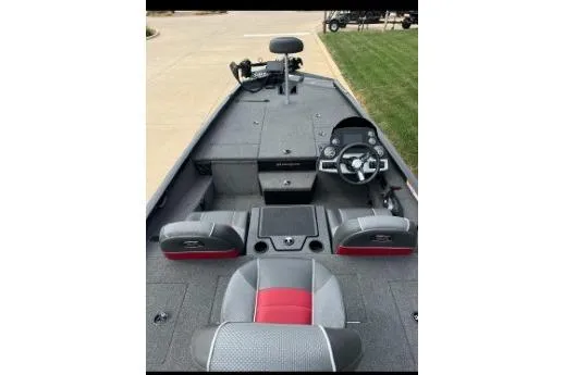 Slide: The Image of 2018 Ranger RT198P fishing boat interior with steering console and seating. - 2