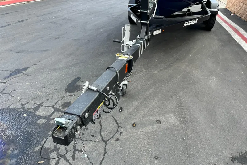 Slide: The Image of 2021 Bayliner DX 2050 boat interior with cushioned seating and sleek design. - 11