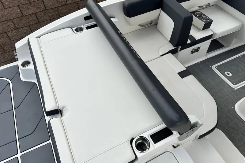 Slide: The Image of Interior of 2021 Bayliner DX 2050 boat with stylish seating and cup holders. - 13