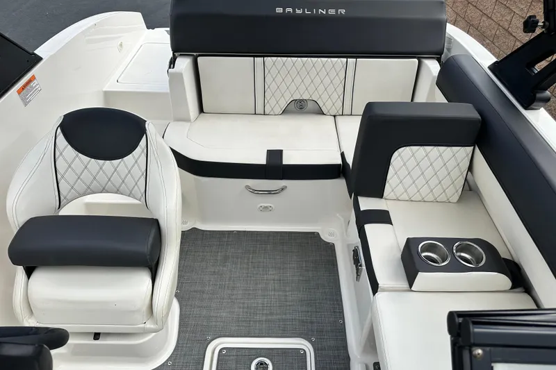 Slide: The Image of 2021 Bayliner DX 2050 boat interior with stylish white and black seating. - 14