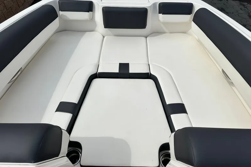 Slide: The Image of Engine compartment of a 2021 Bayliner DX 2050 boat, featuring a powerful 4.5L 200 HP engine. - 20
