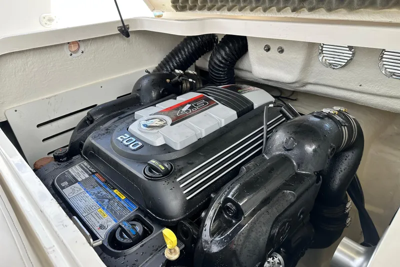 Slide: The Image of Trailer hitch of a 2021 Bayliner DX 2050 boat on pavement. - 24