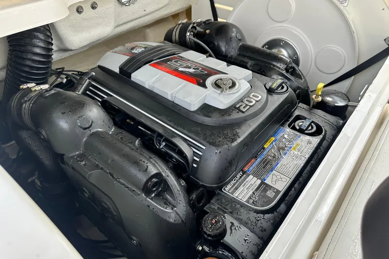 Slide: The Image of Bayliner DX 2050 boat capacity label, 9 persons or 1270 lbs, 2021 model compliance. - 25