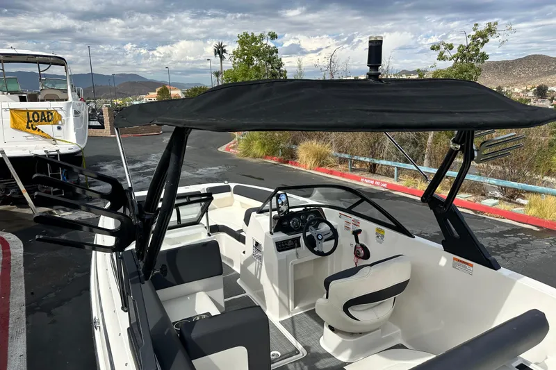 Slide: The Image of 2021 Bayliner DX 2050 boat hull identification number on blue surface. - 26