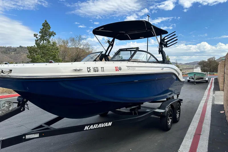 Slide: The Image of Bayliner DX 2050 boat stern with propeller and ladder, 2021 model. - 7