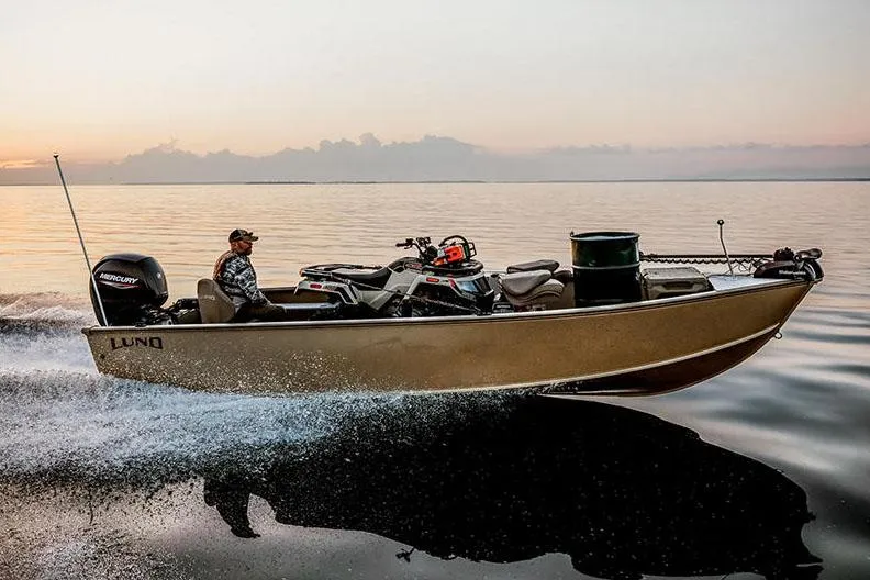 Slide: The Image of Manufacturer Provided Image: 2025 Lund 2075 Alaskan Tiller boat cruising on a calm lake at sunset. - 16