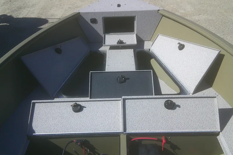 Slide: The Image of 2026 Lund 2075 Alaskan Tiller boat interior with storage compartments open. - 3