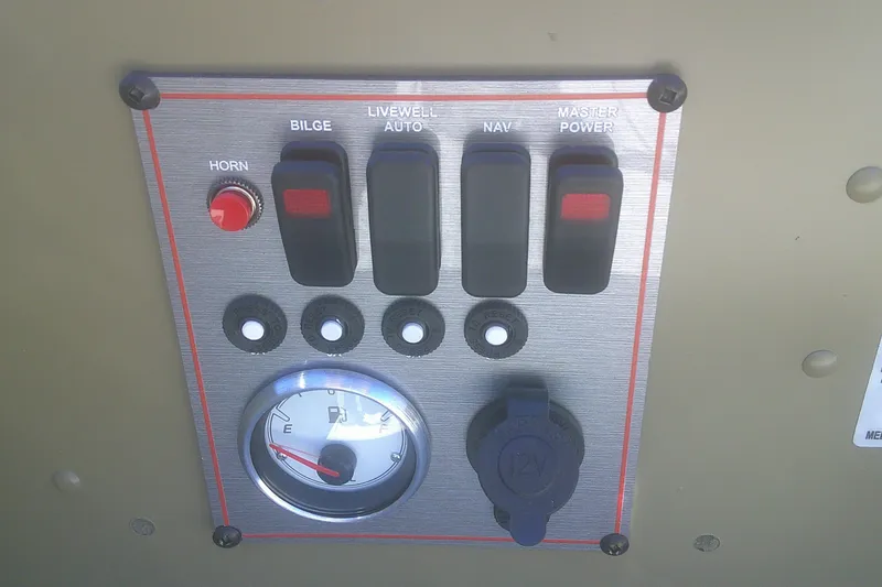 Slide: The Image of Control panel of 2026 Lund 2075 Alaskan Tiller boat with switches and fuel gauge. - 6
