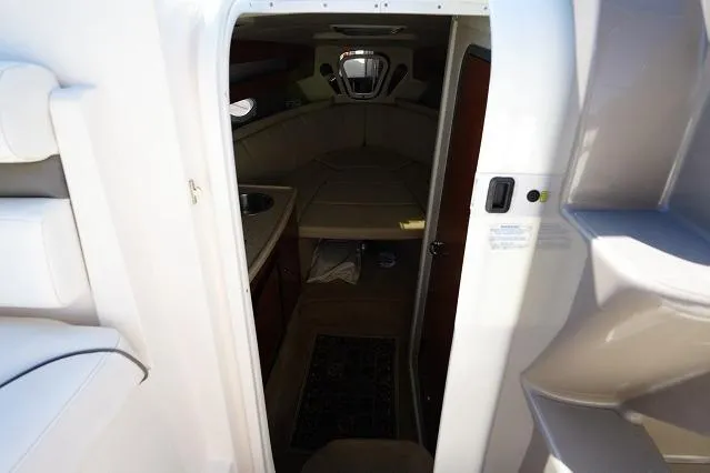 Slide: The Image of Interior view of 2007 Rinker 280 Fiesta Vee cabin with seating and kitchenette. - 15