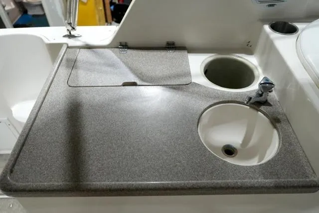 Slide: The Image of 2007 Rinker Fiesta Vee 280 boat kitchenette with sink and countertop. - 25
