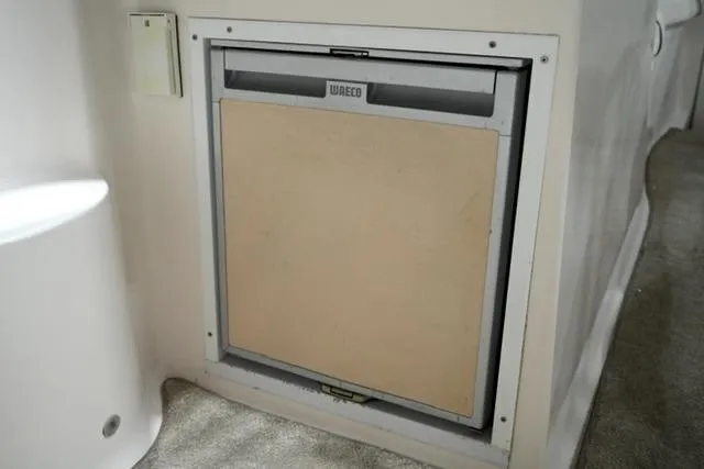 Slide: The Image of Built-in fridge on 2007 Rinker Fiesta Vee 280 boat interior. - 26