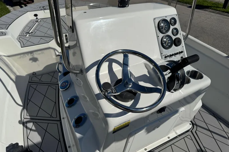 Slide: The Image of 2019 Cape Craft 180 boat console with steering wheel and gauges. - 12