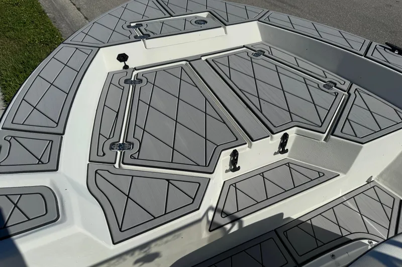 Slide: The Image of 2019 Cape Craft 180 boat deck with gray diamond-patterned non-slip surface. - 14