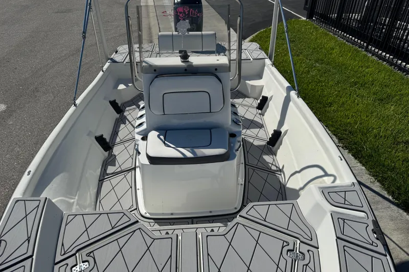 Slide: The Image of 2019 Cape Craft 180 boat interior with gray deck, center console, and seating. - 17
