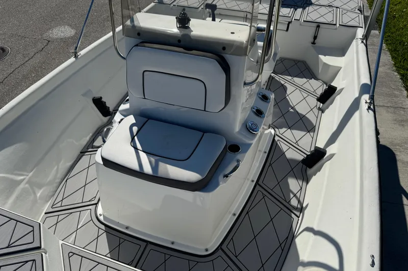 Slide: The Image of 2019 Cape Craft 180 boat interior with cushioned seating and modern design. - 21